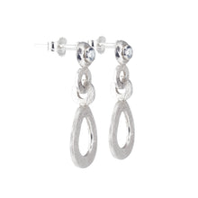 Load image into Gallery viewer, A side view image of the hand-textured silver dangle post earrings. 