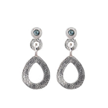 Load image into Gallery viewer, These hand-textured silver dangle post earrings features 3mm greenish-blue Montana sapphires.